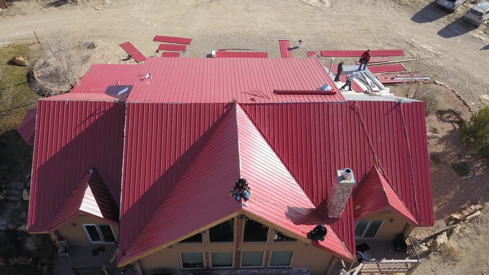 ProPanel metal roof installation in red — residential project by GEN3 Roofing in Colorado