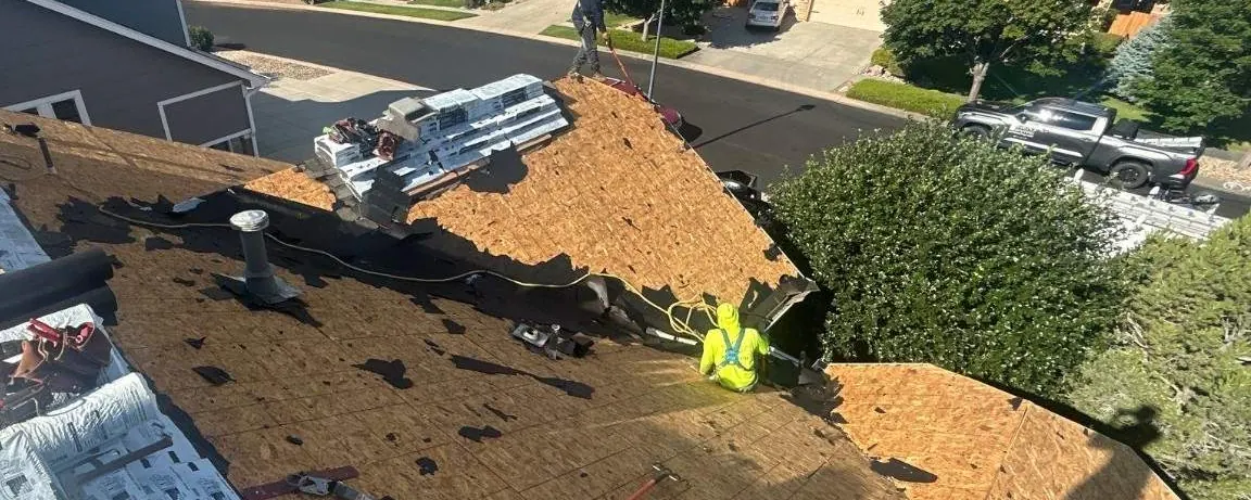 Before, Colorado Springs: a hail-damaged roof stripped for replacement