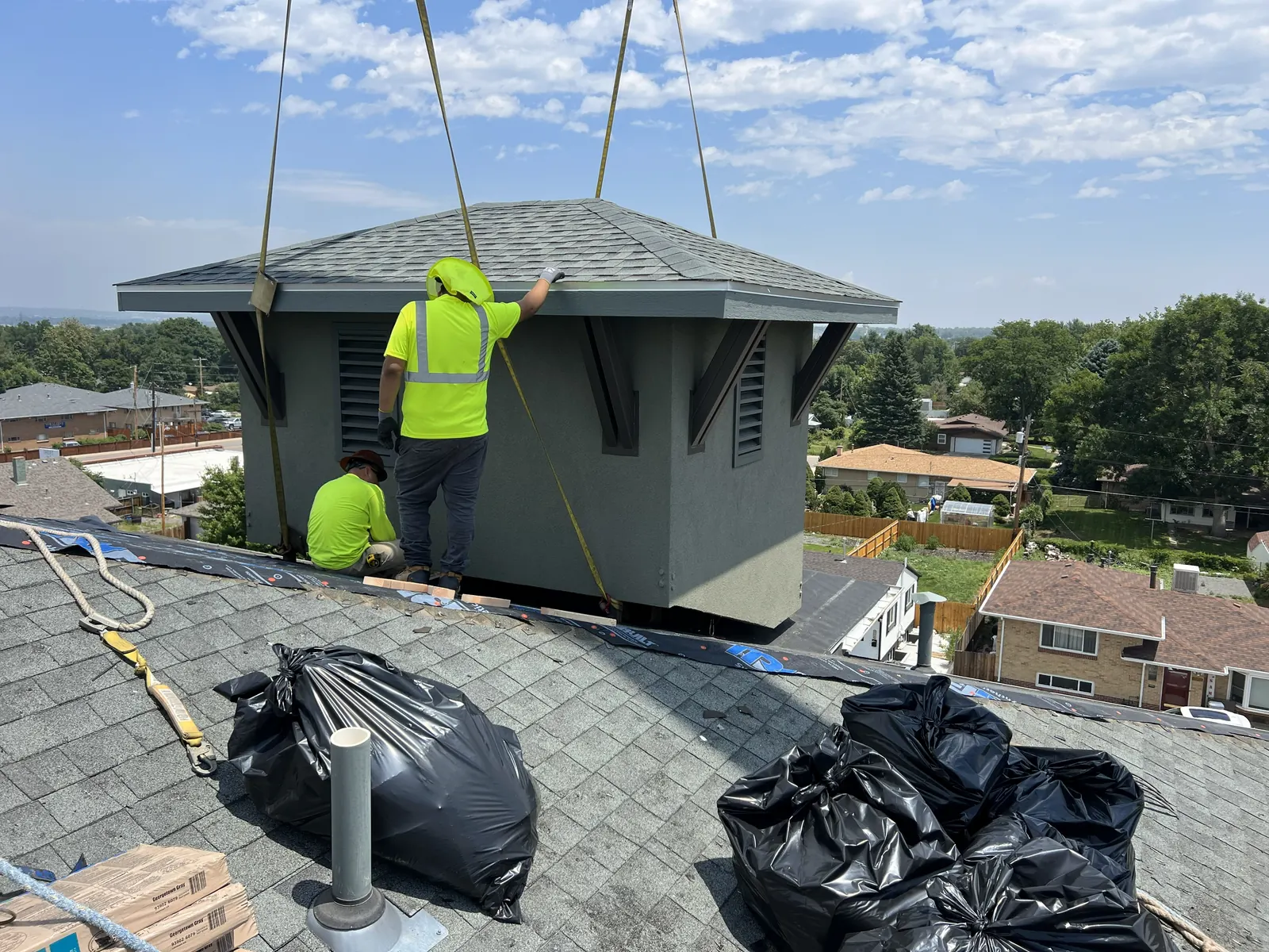 Gen 3 crew re-roofing around a rooftop telecom structure